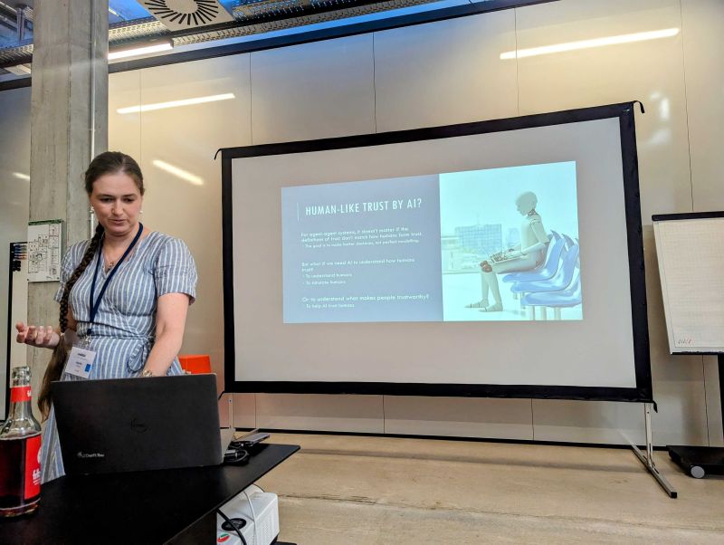 Myrthe L. Tielman is pitching her view on how AI systems can rely and trust on human input Hybrid Human-Artificial Intelligence Conference #HHAI23 . Pic by Nicolo' Brandizzi
